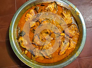 Close up of delicious fish curry in a bowl on the table