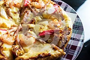 close up delicious italian seafood pizza with shrimp cheese prawn topping