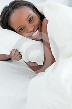 Close up of a delighted woman waking up