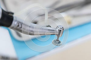 Close-up on dental surgery handpiece burr with round tip for polishing