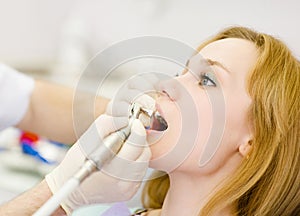 Close-up dentist procedure of teeth polishing with clean