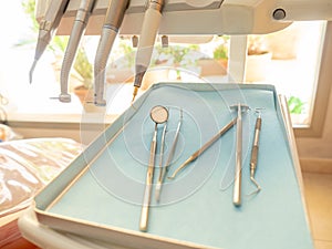 Close-up of a dentist`s instrument in the clinic where he attends patients photo