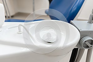 Close-up dentist sink. Dental work in clinic. Operation, tooth replacement. Medicine, health, stomatology concept