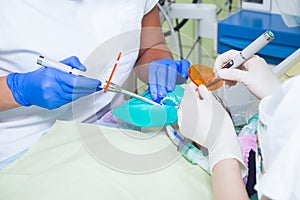 Close-up of a dentist treat teeth