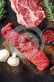 Close up denver steak cutwith set of different alternative types of raw beef steaks on a rustic metall background top view layflat