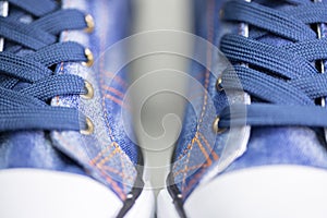 close up of denÃ­m sneakers