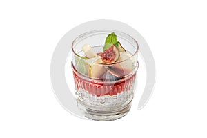 Close-up dessert in a glass with tops of fruit and ice cream, a sweet treat