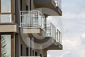 Close-up detail of apartment building wall with balconies and sh