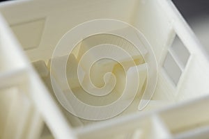Close-up of detail of bedroom with table and chair 3D model printed on 3D printer with FDM technology for architectural