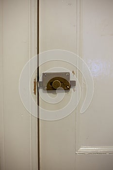Close up detail of a brass door lock on a door