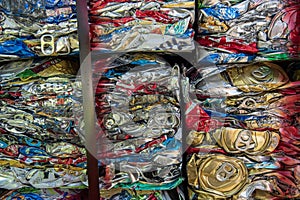 Close up detail crushed compressed aluminum drink cans at recycling center