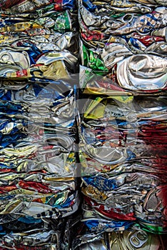 Close up detail crushed compressed aluminum drink cans at recycling center