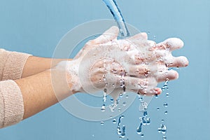 Detail of hands washing with soap.
