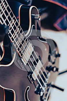 Close-up detail of a four-string electric bass guitar