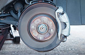 Close-up detail front disc brake on car.