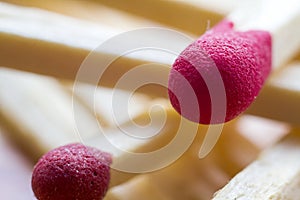 Close-up detail image of two red matches