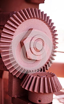 Close up detail of industrial cogs covered in mining ore dust