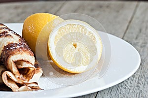 Close up detail of lemon and sugar topped pancakes