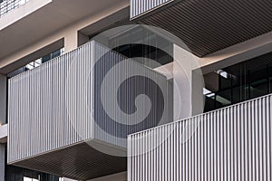 Close-Up Detail of Modern Hotel: Balconies and Windows in Low-Angle Cross-View