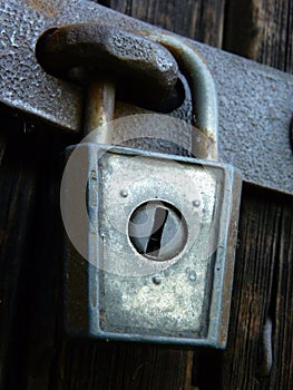 Old Vintage Iron Padlock Lock on Barn Door