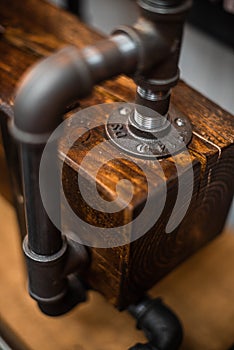 Close up detail of old water valve, shallow depth of field dark antique vintage pressure system space for advertising concept