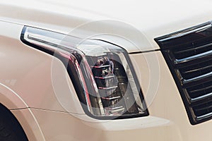 Close up detail on one of the LED headlights modern car.