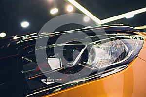 Close up detail on one of the LED headlights modern car.