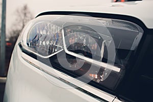 Close up detail on one of the LED headlights modern car.