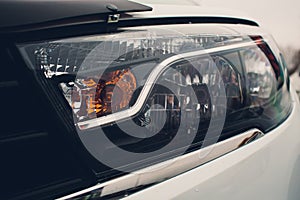 Close up detail on one of the LED headlights modern car.
