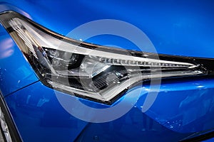 Close up of detail on one of the LED headlights modern and luxury car.