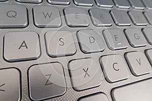 Close-up detail of a QWERTY keyboard of a laptop PC