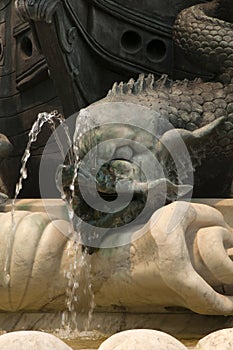 Close-up of detail of serpents in memorial monument