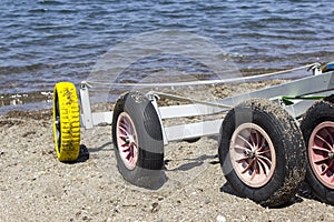 Close-up detail shot of small yacht sailboat wheels on beach at Lesvos, Petra