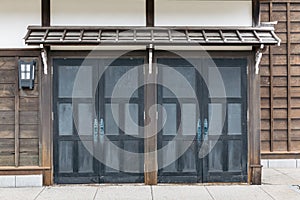 Close up detail sliding door of Edo period architecture style with leaves less tree in Noboribetsu Date JIdaimura Historic Village