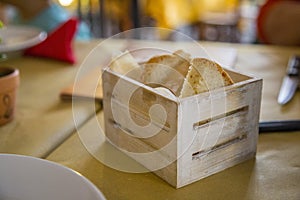 Close-up with detail of a small cassette-shaped breadbasket