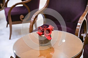 Close up detail of some beautiful Christmas table decorations with red colos.