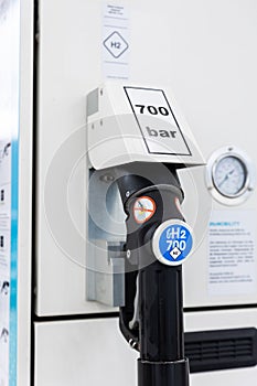 Close-up detail view of hydrogen fuel filler nozzle nozzle adapter car H2 gas filling station in Germany. Refueling