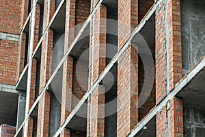 Close-up detail view of a new modern residential house building construction site work under construction. Real estate development