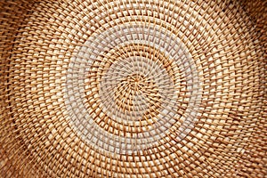 Close up detail view of a wicker basket weave with natural materials