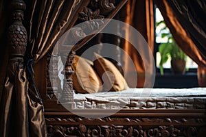 close up on detailed carving of a wooden four poster bed