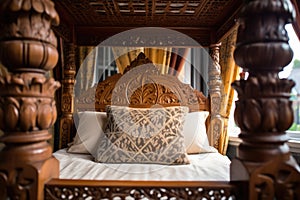 close up on detailed carving of a wooden four poster bed
