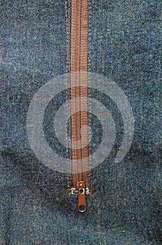 Close-up detailed jeans and brown zipper