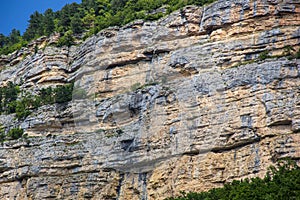 Close up of details of abstract natural stone rock cut texture cross section of weathered granite cliff erosion