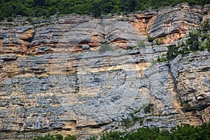 Close up of details of abstract natural stone rock cut texture cross section of weathered granite cliff erosion