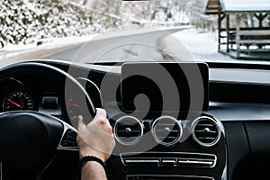 Close up details of driver driving a modern car. Inside of car details, drivers view through windshield