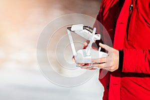 Close up details of drones remote control with man piloting the aircraft