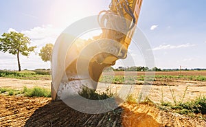 Close up details of industrial excavator working on construction site