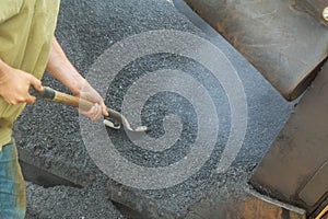 close-up details of industrial machinery working with asphal industrial laying fresh asphalt