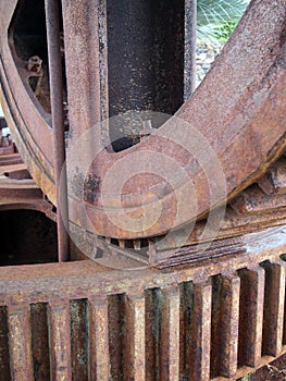 Close up details of large old rusty steel industrial cog wheels
