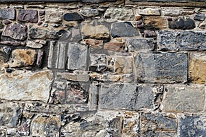 Close up details pattern of background texture of stone brick wall on ancient fortress building from medieval architecture